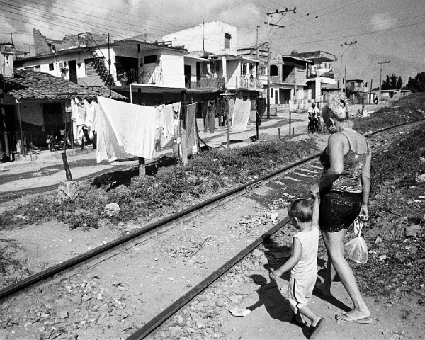 350-girl-RR-tracks-shacks-back
