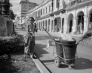 old-woman-sweeping-street