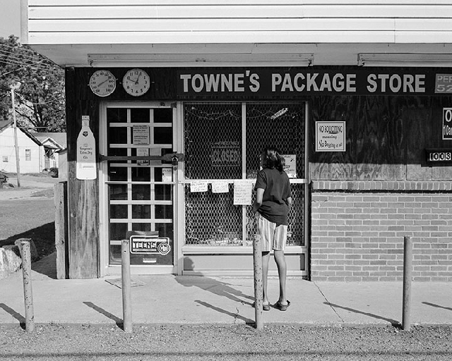 Townes-package-liquor-Clark Clarksdale MS: I was photographing the interesting signs in the window when the first customer of the day arrived. Except the proprietor was not prompt with the 10 AM opening time.