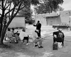 minister-Walter-Horton-Shel Shelby MS: Walter Horton from the Israel Church of God making his weekly attempt to preach to the locals. They just sat under the tree drinking beer.
