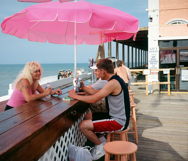 Barmaid-on-pier-w-2-custome 