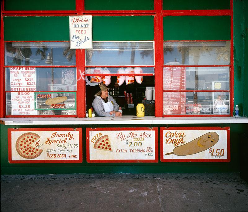 man-in-window-of-pizza-king 