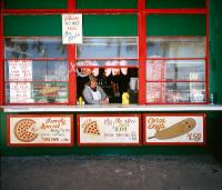 man-in-window-of-pizza-king