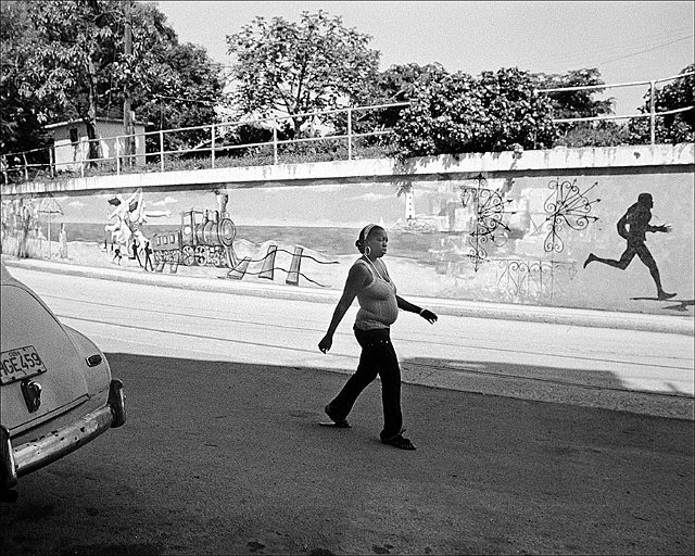 fat-lady-walking-runner-on-mural-back