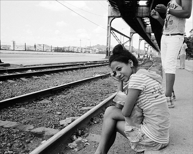 girl-curb-under-RR-tracks