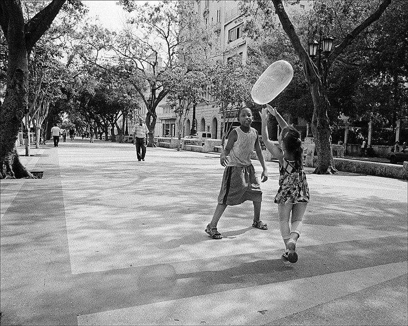 kids-playing-volleyball-w-condom-Prado-2.jpg